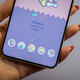 A photo of a person holding the bottom edge of the Galaxy s22+